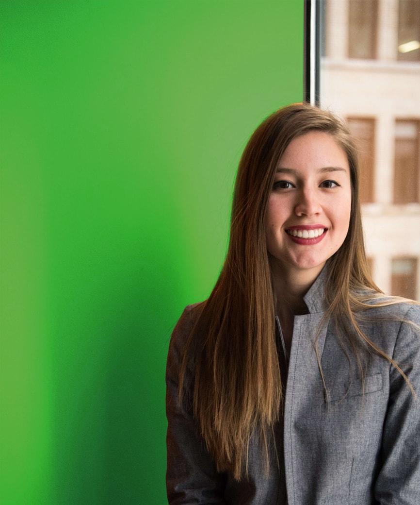 Person in front of a green background